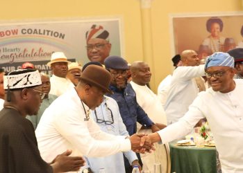 FCT Minister, Nyesom Wike (Right) in a handshake with the Rivers State APC Governorship candidate, Kingsley Chinda while the Governorship candidate of AA, Ben Eke (1st Left), others watch during a luncheon organised by the Rivers State Rainbow Coalition held in Port Harcourt on Saturday, in honour of candidates participating in the forthcoming Governorship, National Assembly and State Assembly elections in Rivers State
