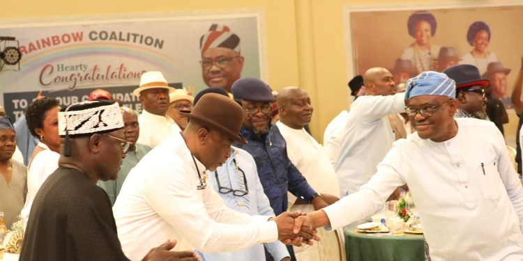 FCT Minister, Nyesom Wike (Right) in a handshake with the Rivers State APC Governorship candidate, Kingsley Chinda while the Governorship candidate of AA, Ben Eke (1st Left), others watch during a luncheon organised by the Rivers State Rainbow Coalition held in Port Harcourt on Saturday, in honour of candidates participating in the forthcoming Governorship, National Assembly and State Assembly elections in Rivers State